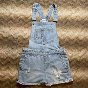 Adorable Love Tree, light wash denim overalls in size 26 medium.